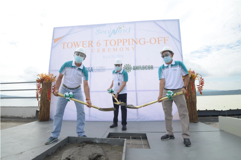 Leading the Topping-off ceremony are members of the management of the Anflo Group of Companies (l-r) Engr. Ruel A. Tan, Oscar V. Grapa, and Alfred E. Samson.
